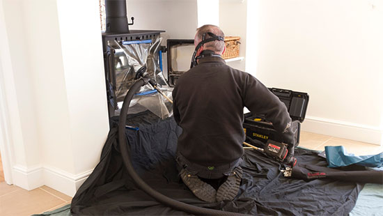 fireplace being cleaned